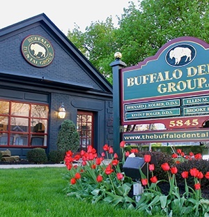 green landscape in front of dental office