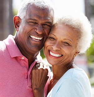 husband and wife laughing and smiling