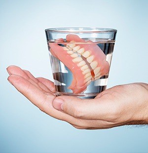 dentures in glass of water