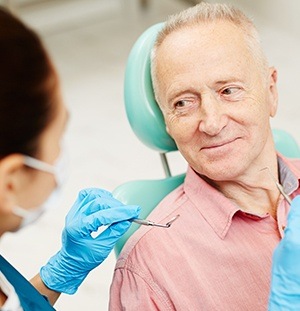 older man laying in exam chair