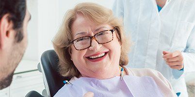 older woman laying back in chair