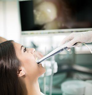 dentist using intraoral camera