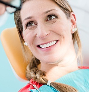 woman smiling up at dentist